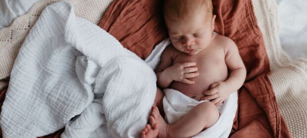 Lifestyle Newborn Photography in a stylish, modern nursery setting